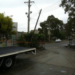 Condemned private pole only staying up by the overhead power lines ready to fall over