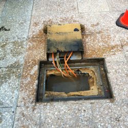 Electricity pit was live due to water drainage error installed by another contractor